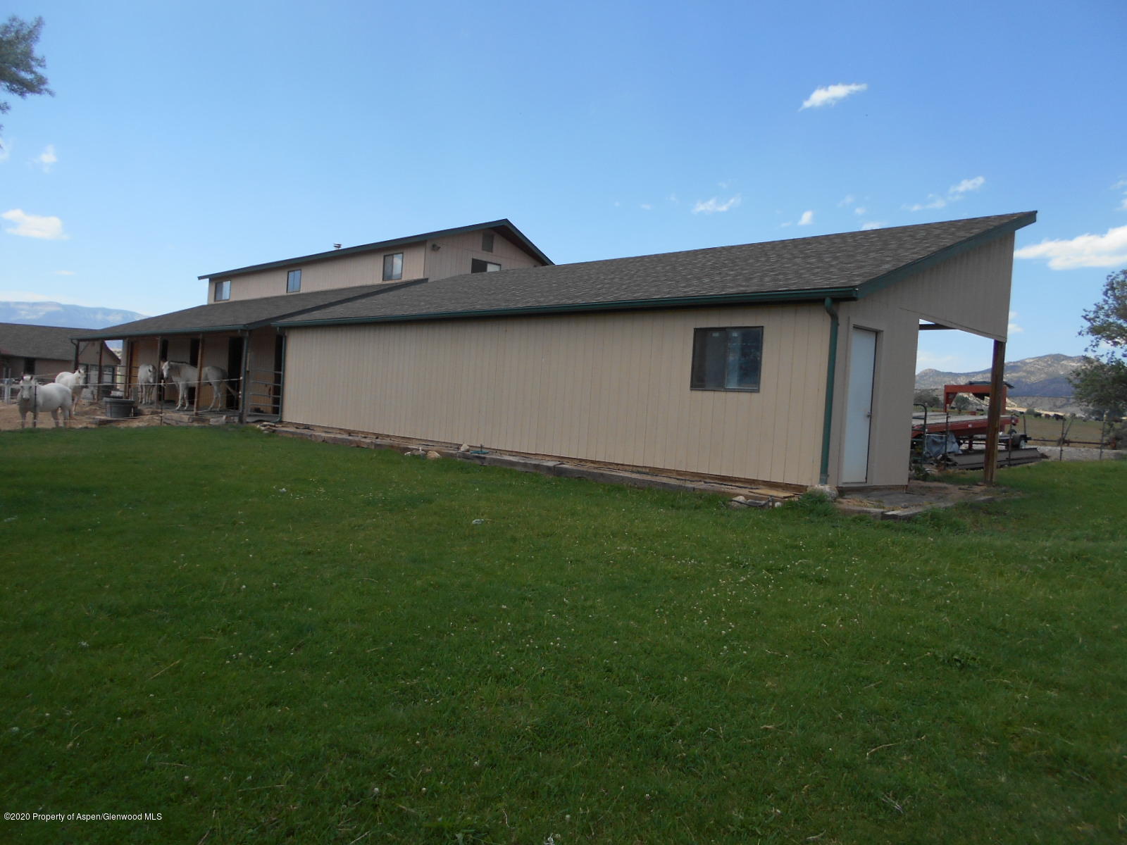 2959 County Road 210 Rifle, CO 81650 - Photo 54 of 63 a backyard of a house with lots of green space and outdoor seating