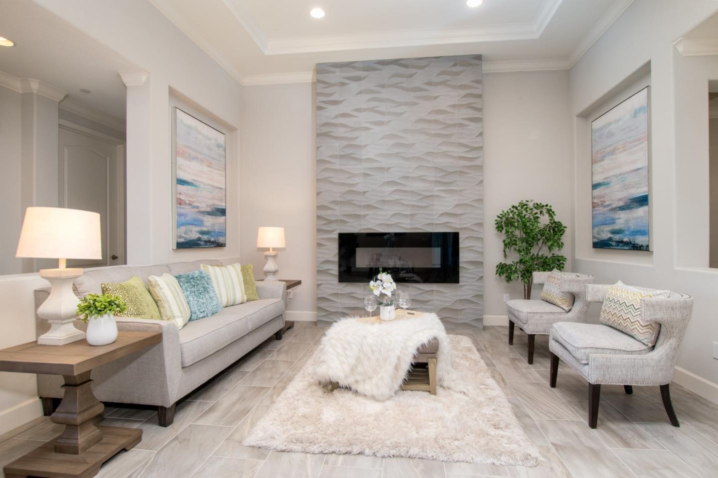 1655 Martinez Way Morgan Hill, CA 95037 - Photo 2 of 40 a living room with furniture and a fireplace