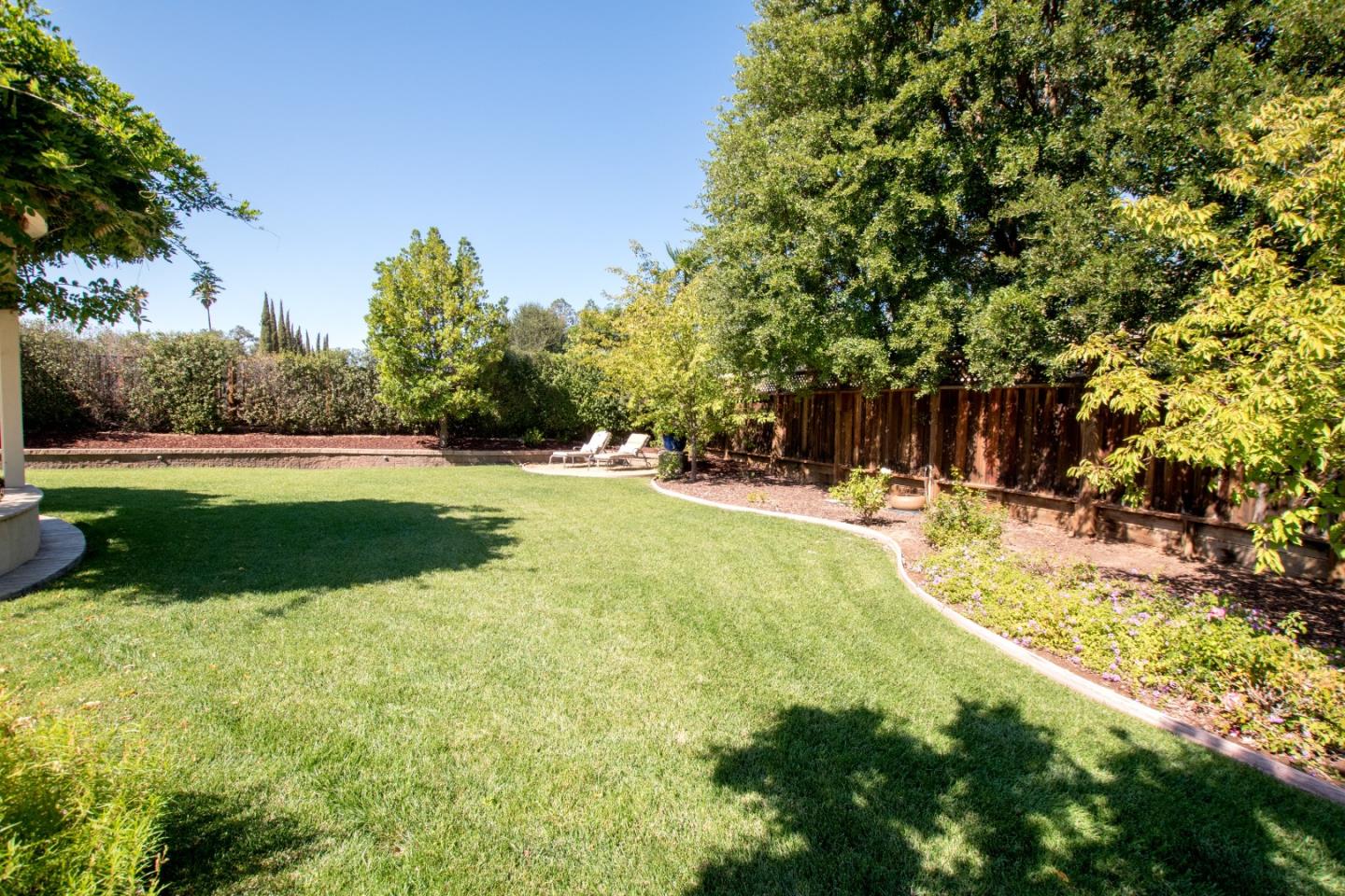 1655 Martinez Way Morgan Hill, CA 95037 - Photo 22 of 40 a view of yard with swimming pool and green space