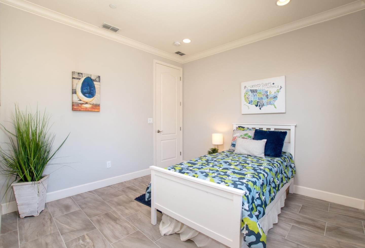 1655 Martinez Way Morgan Hill, CA 95037 - Photo 26 of 40 a room with a bed and a potted plant