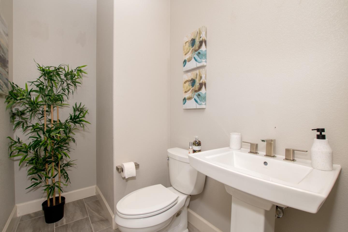 1655 Martinez Way Morgan Hill, CA 95037 - Photo 31 of 40 a bathroom with a toilet a sink and a mirror