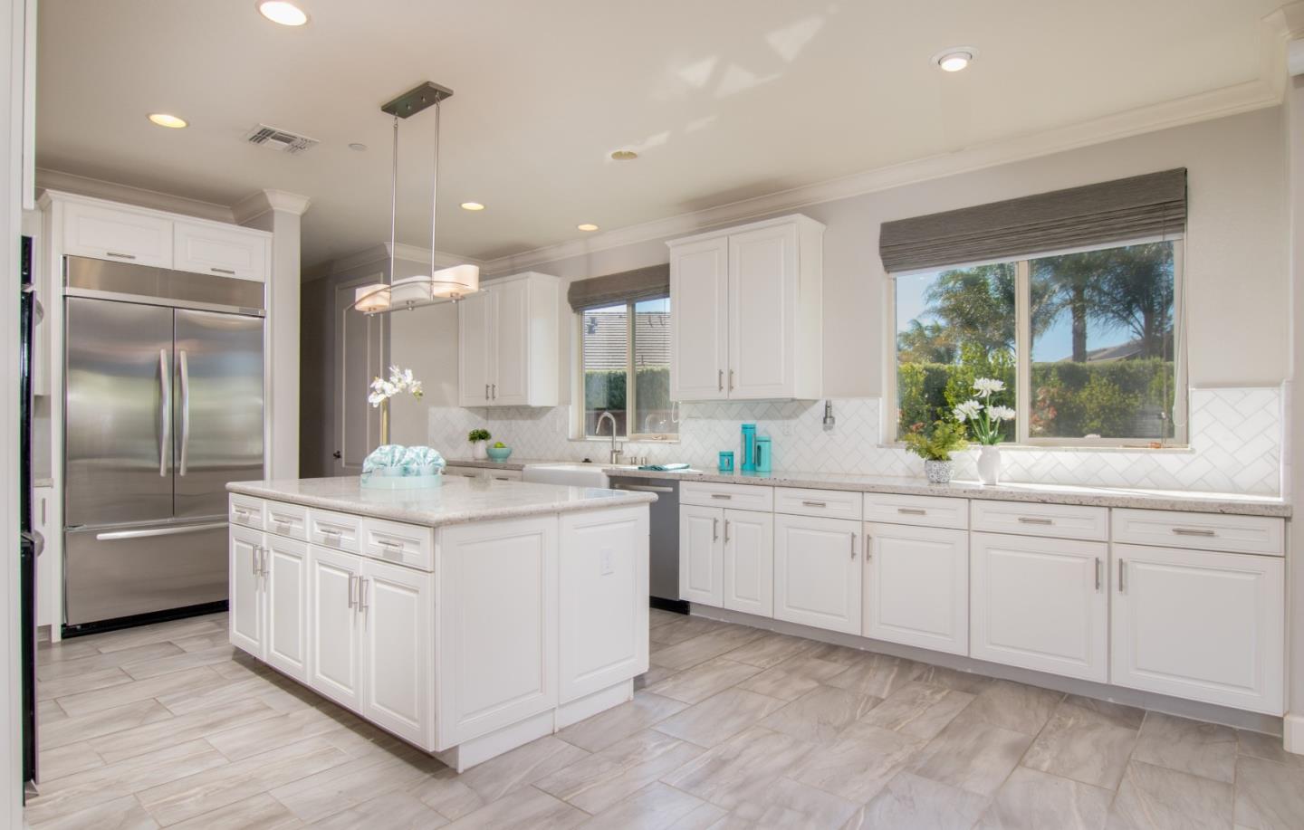 1655 Martinez Way Morgan Hill, CA 95037 - Photo 32 of 40 a kitchen with stainless steel appliances granite countertop a sink and a refrigerator