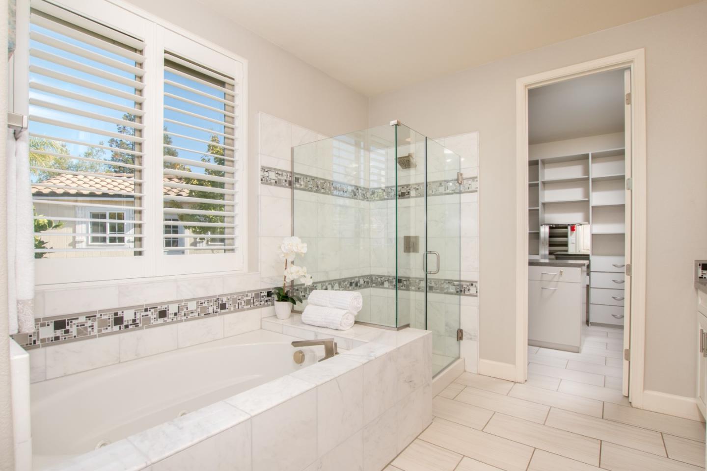 1655 Martinez Way Morgan Hill, CA 95037 - Photo 37 of 40 a spacious bathroom with a tub shower and windows