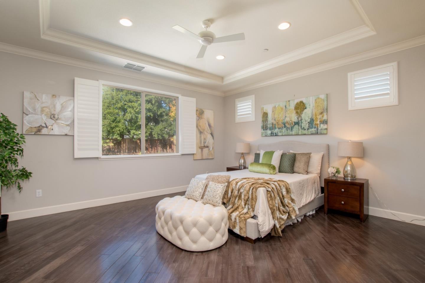 1655 Martinez Way Morgan Hill, CA 95037 - Photo 39 of 40 a bedroom with bed and a potted plant