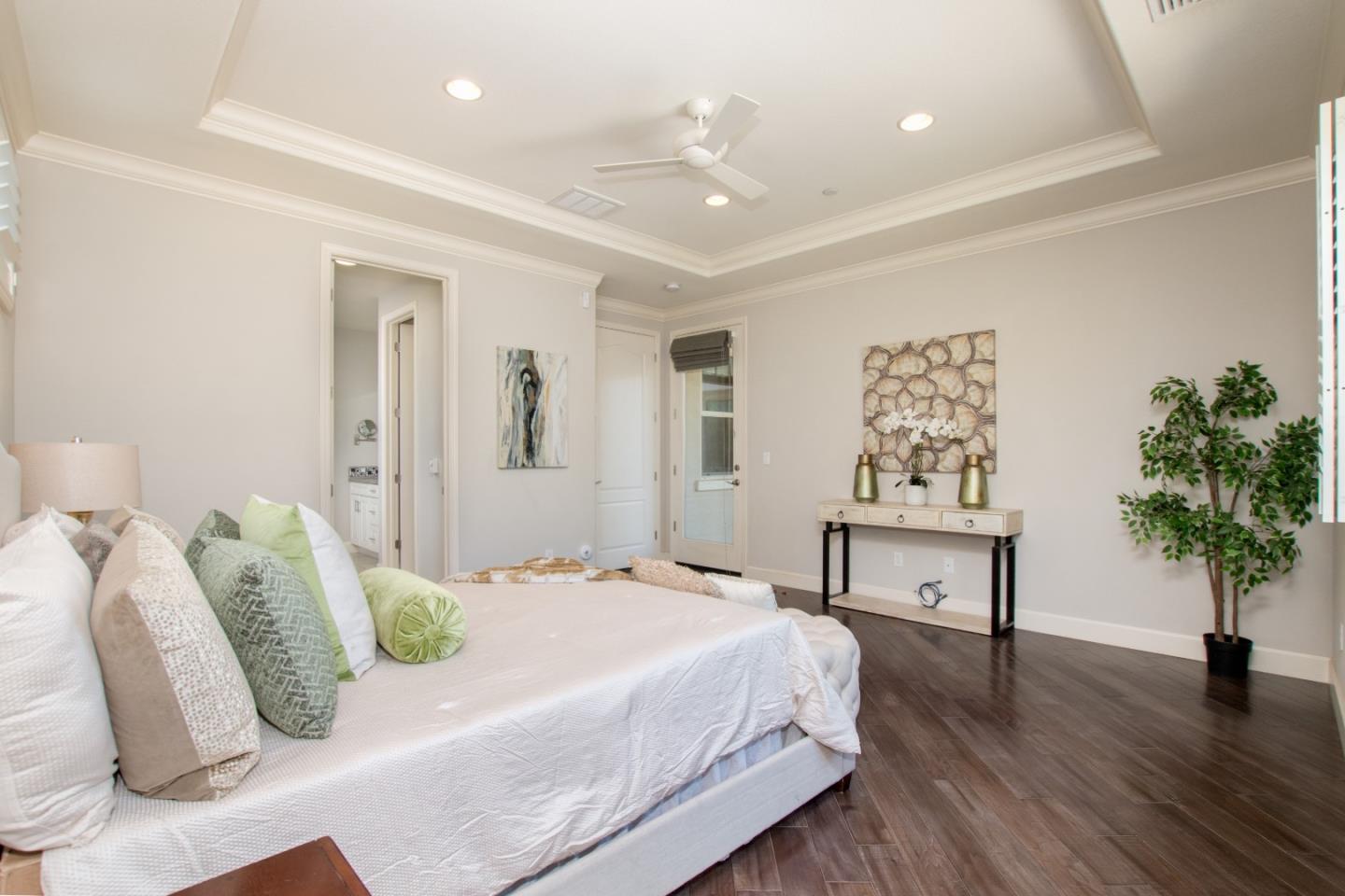 1655 Martinez Way Morgan Hill, CA 95037 - Photo 40 of 40 a bedroom with bed and a potted plant