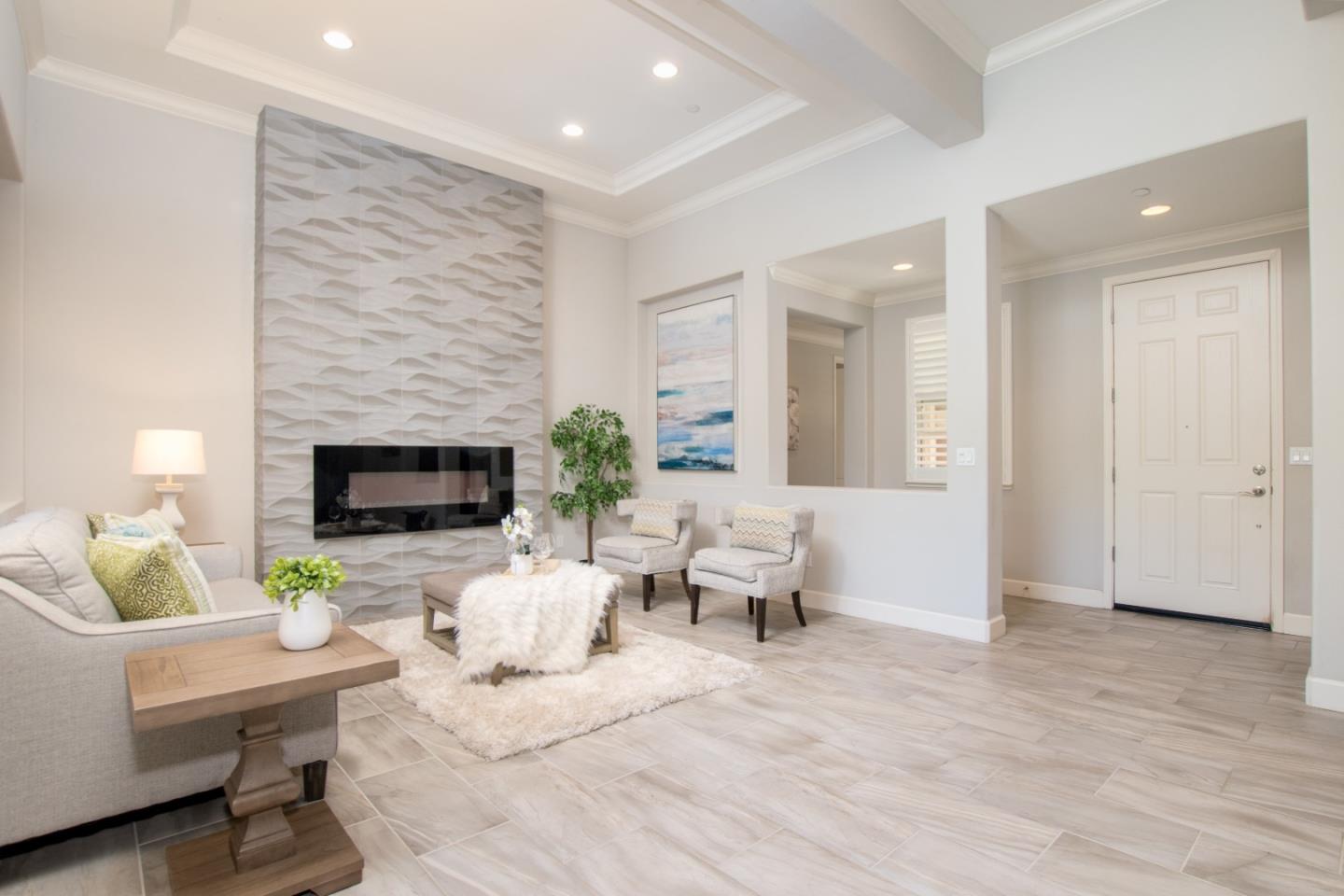 1655 Martinez Way Morgan Hill, CA 95037 - Photo 4 of 40 a living room with furniture potted plant and a fireplace