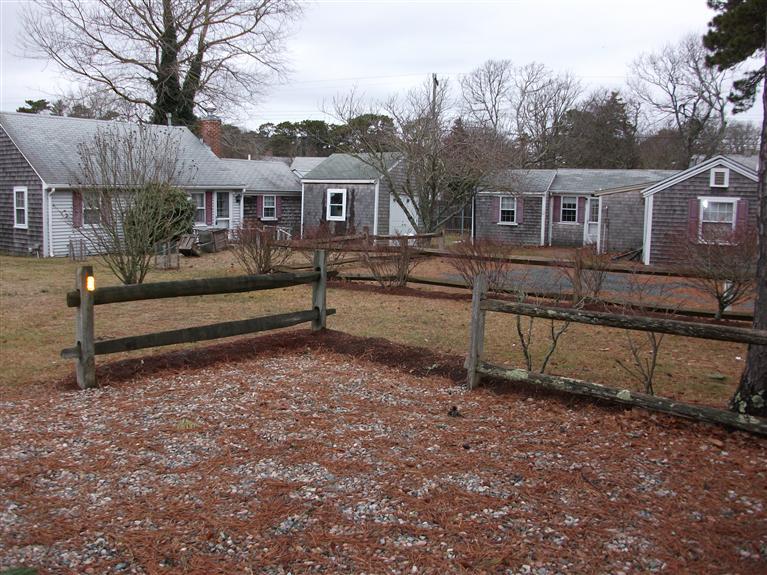 a view of house with outdoor space and sitting area