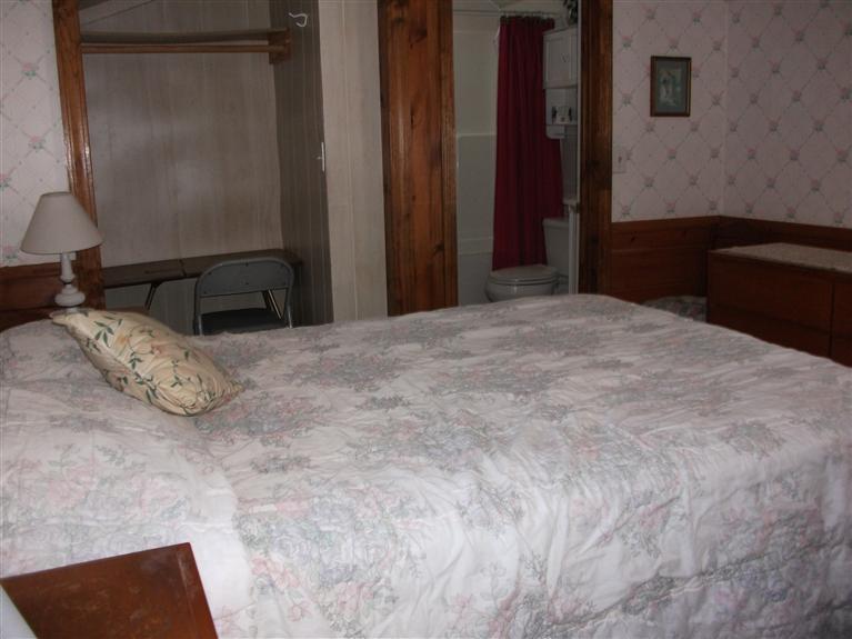 17 Beach Hills Road Dennis, MA 02639 - Photo 11 of 16 a bedroom with a bed and a dresser