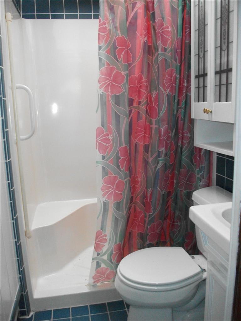 17 Beach Hills Road Dennis, MA 02639 - Photo 13 of 16 a white toilet sitting next to a bath tub and sink