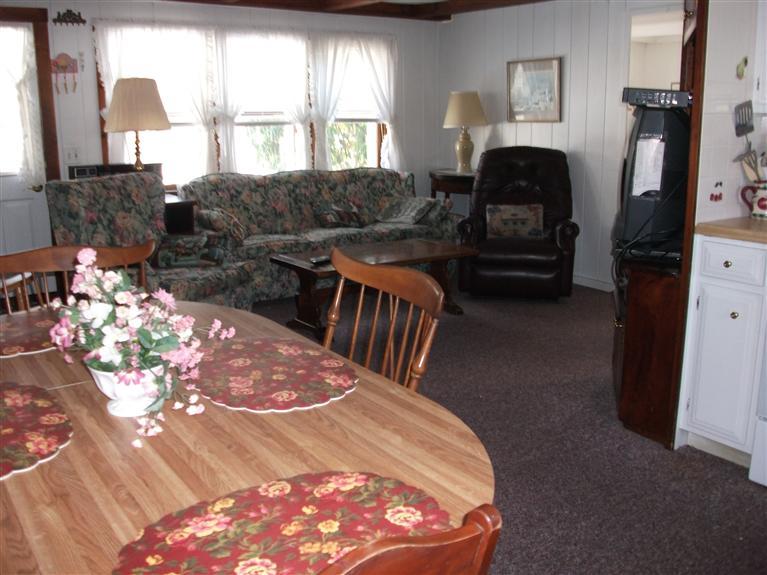 17 Beach Hills Road Dennis, MA 02639 - Photo 15 of 16 a bedroom with furniture and a fireplace