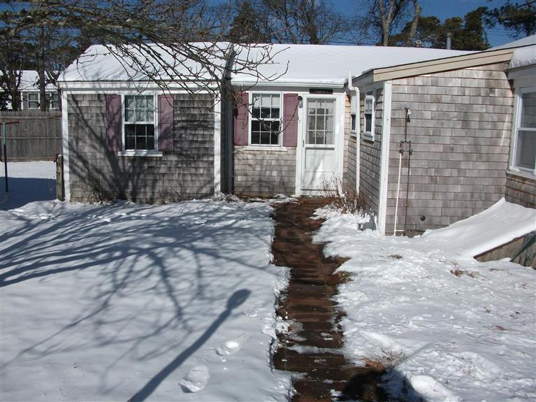 17 Beach Hills Road Dennis, MA 02639 - Photo 4 of 16 a front view of a house with a yard