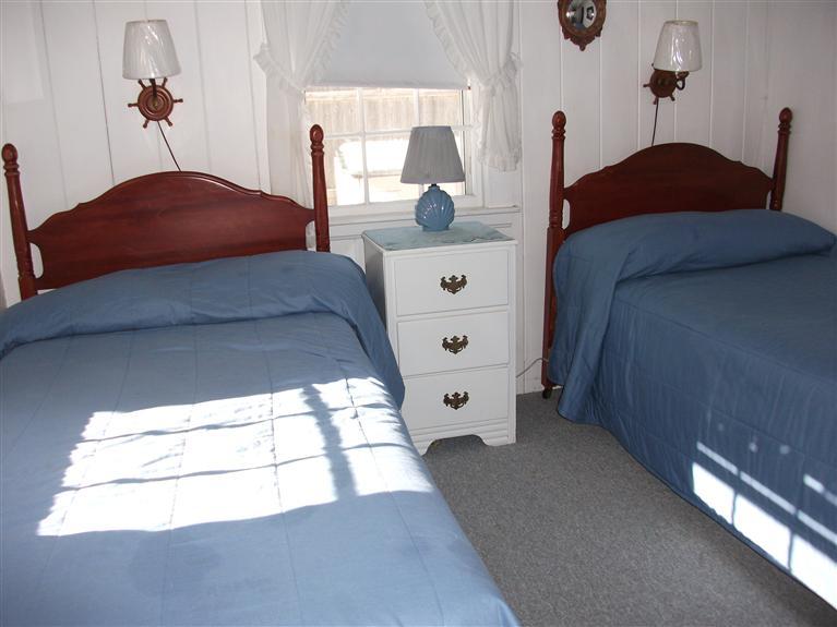 17 Beach Hills Road Dennis, MA 02639 - Photo 6 of 16 a bedroom with a bed and a mirror