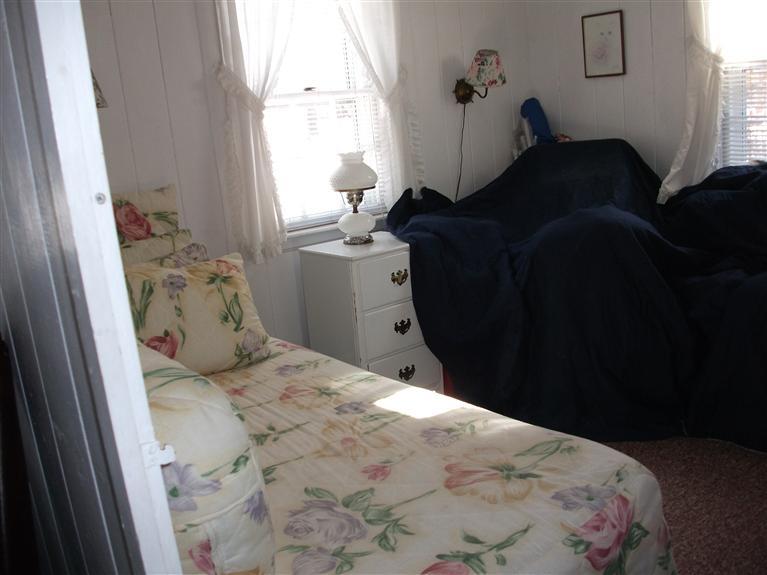 17 Beach Hills Road Dennis, MA 02639 - Photo 8 of 16 a bedroom with a bed and a window