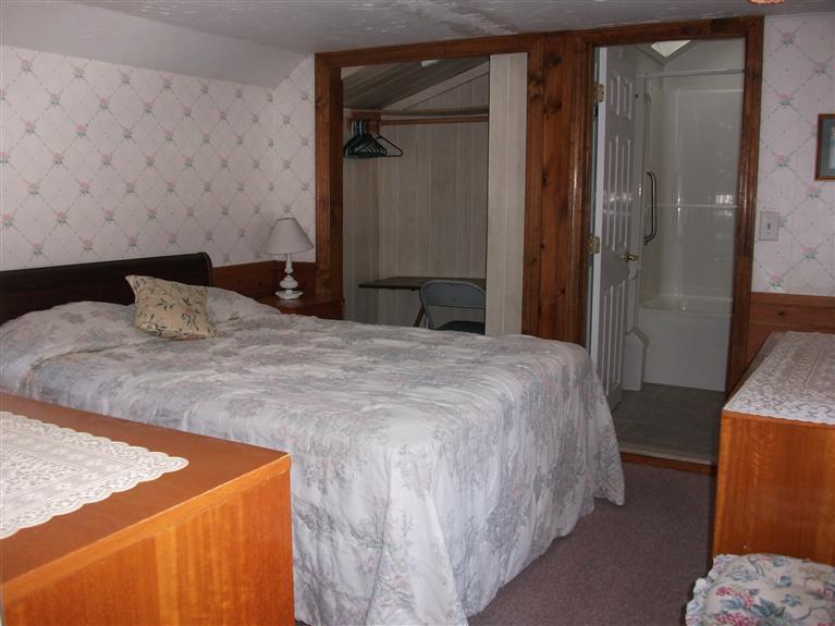 17 Beach Hills Road Dennis, MA 02639 - Photo 10 of 16 a bedroom with a bed and a mirror