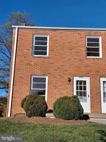 a brick building with a small yard