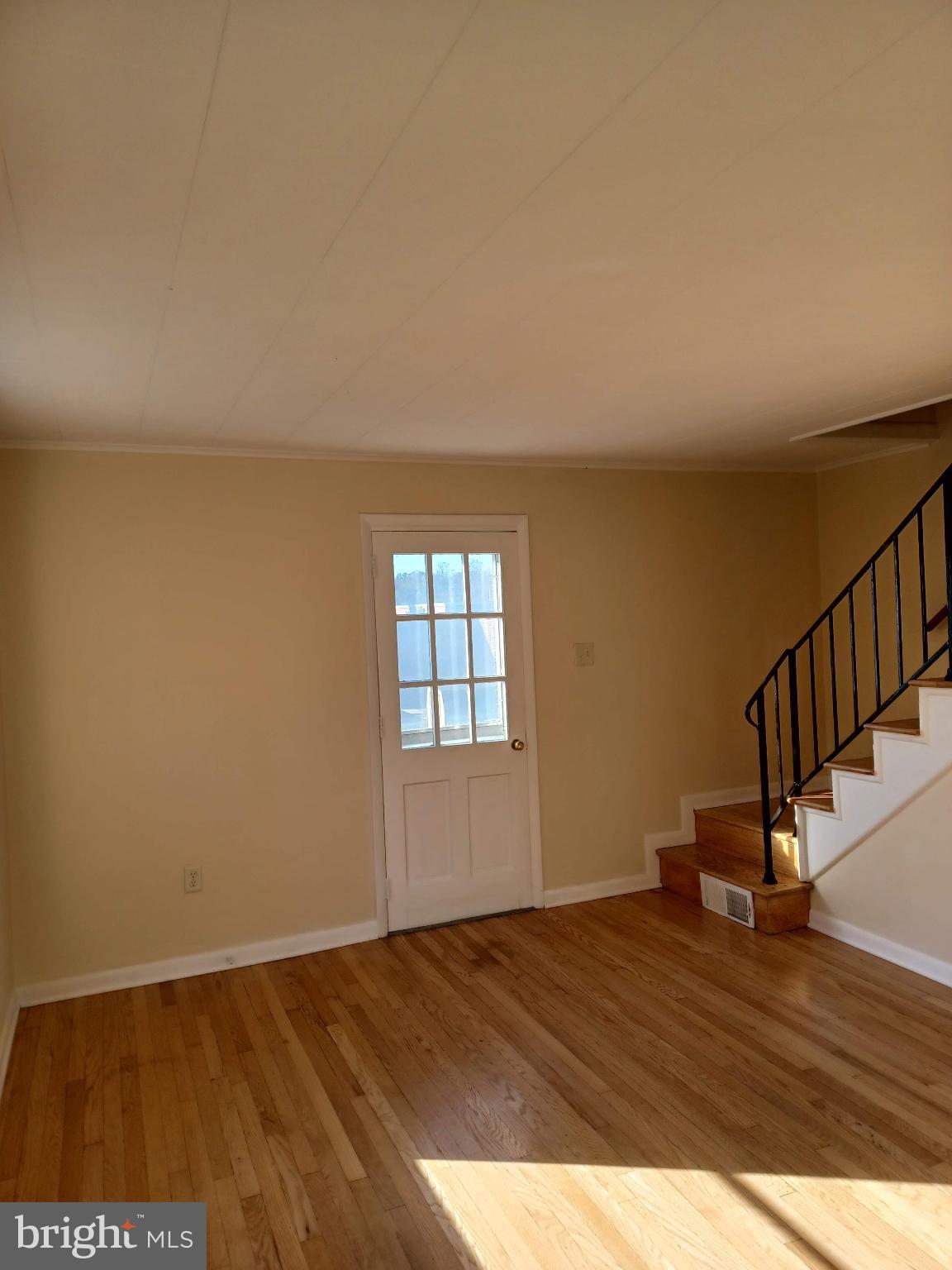 202 East Whitlock Avenue Winchester, VA 22601 - Photo 3 of 8 a view of empty room with wooden floor and fan