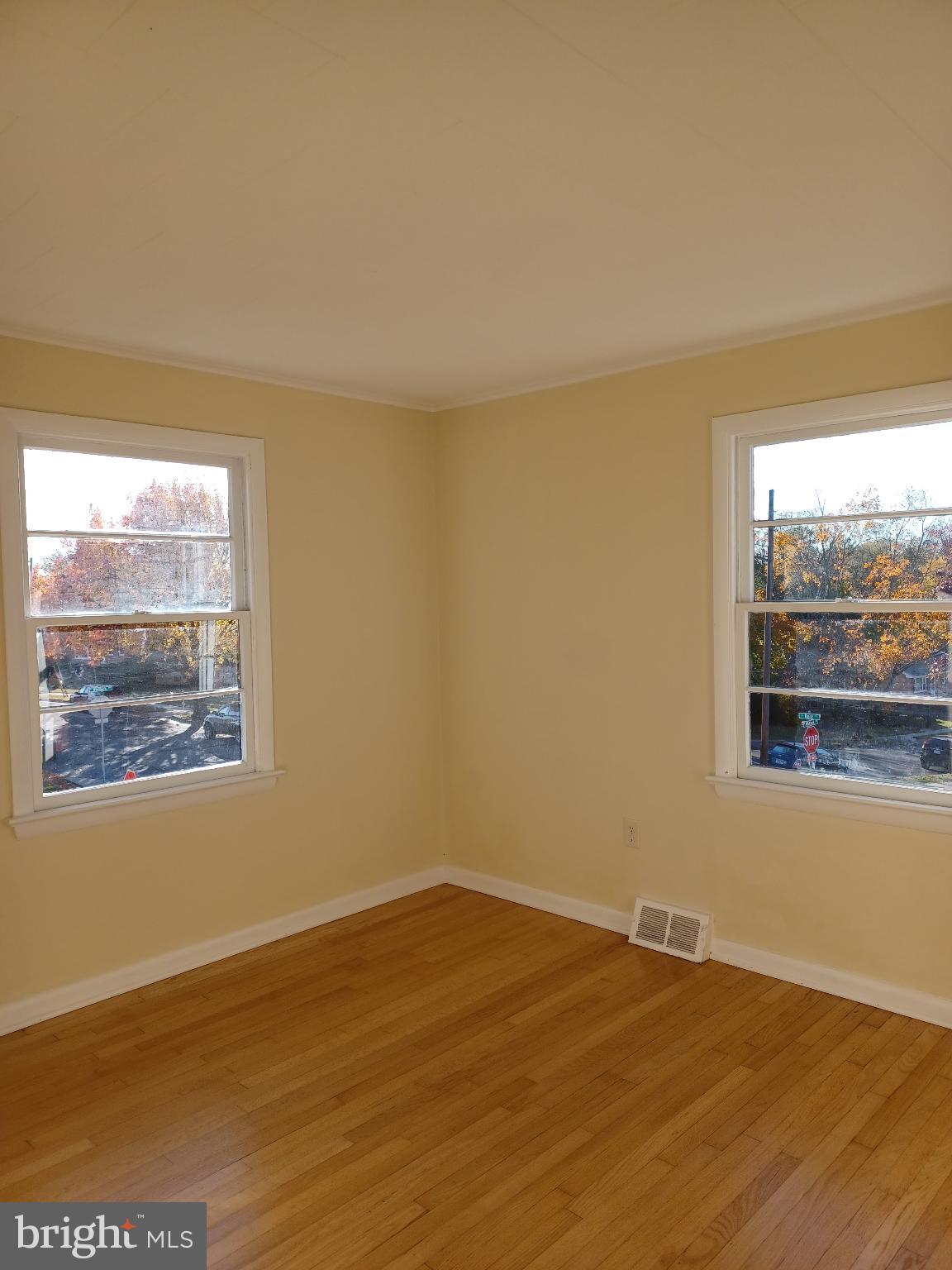 202 East Whitlock Avenue Winchester, VA 22601 - Photo 8 of 8 a view of an empty room with wooden floor and a window