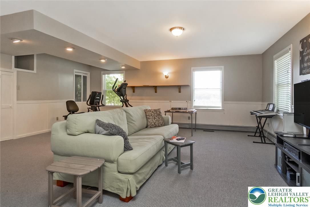 9461 Red Road Kempton, PA 19529 - Photo 22 of 55 A versatile bonus room offers ample space for recreation and relaxation, complemented by recessed and flush-mount lighting.