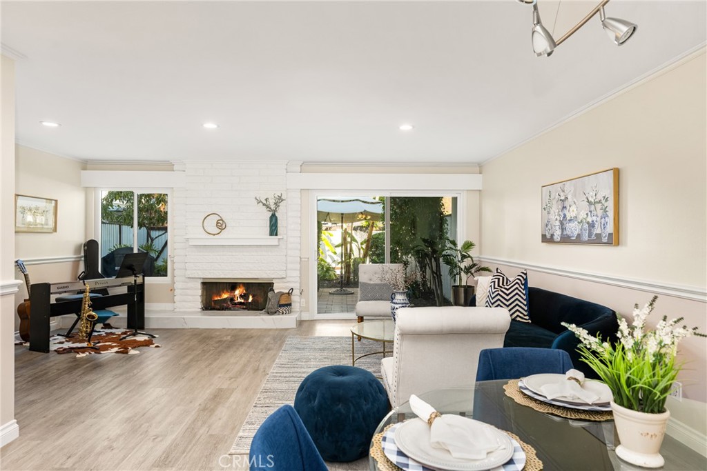 96 Seton Road Irvine, CA 92612 - Photo 11 of 51 a living room with furniture potted plant and a fireplace
