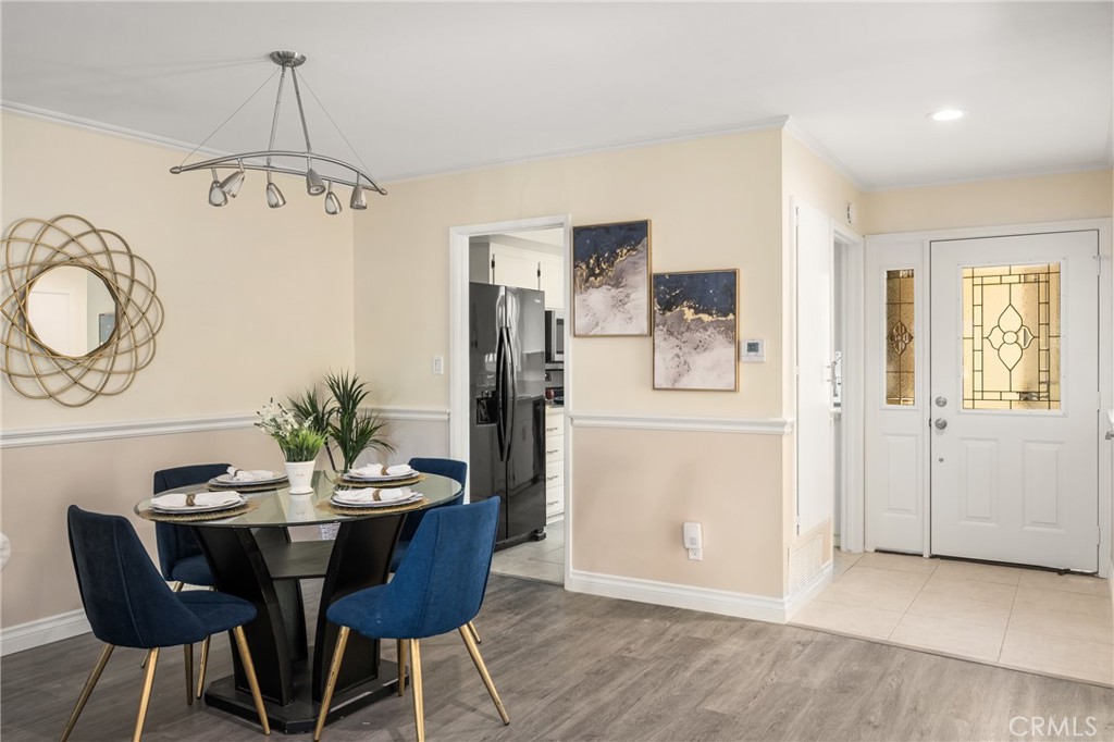 96 Seton Road Irvine, CA 92612 - Photo 19 of 51 a view of a dining room with furniture and wooden floor