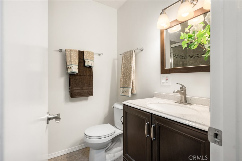 96 Seton Road Irvine, CA 92612 - Photo 28 of 51 a bathroom with a sink a toilet and a mirror