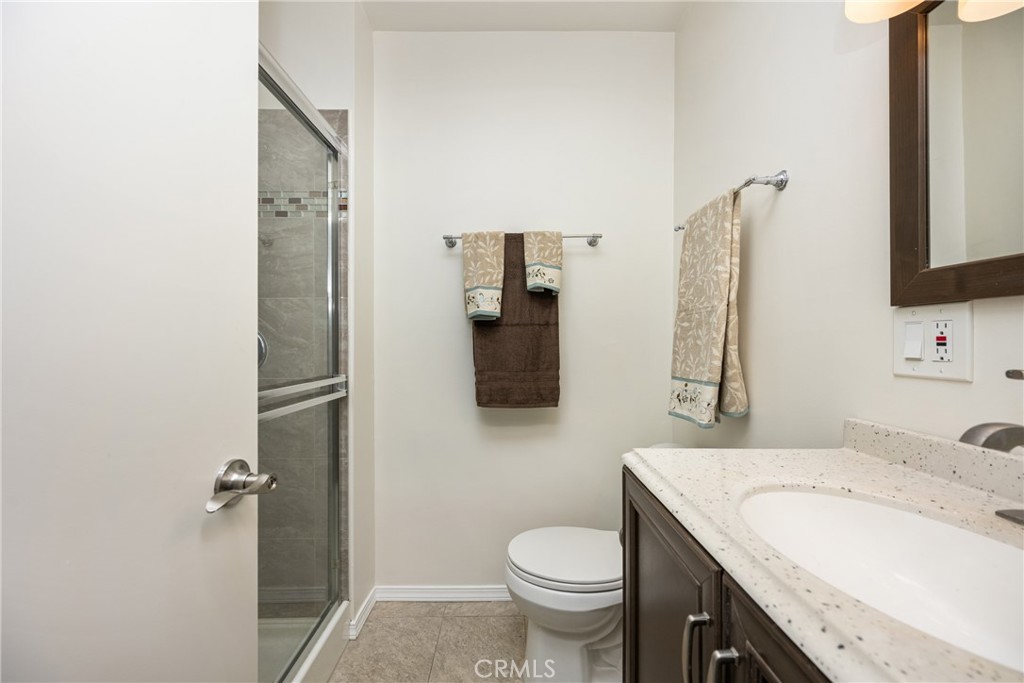 96 Seton Road Irvine, CA 92612 - Photo 29 of 51 a bathroom with a granite countertop sink toilet and shower