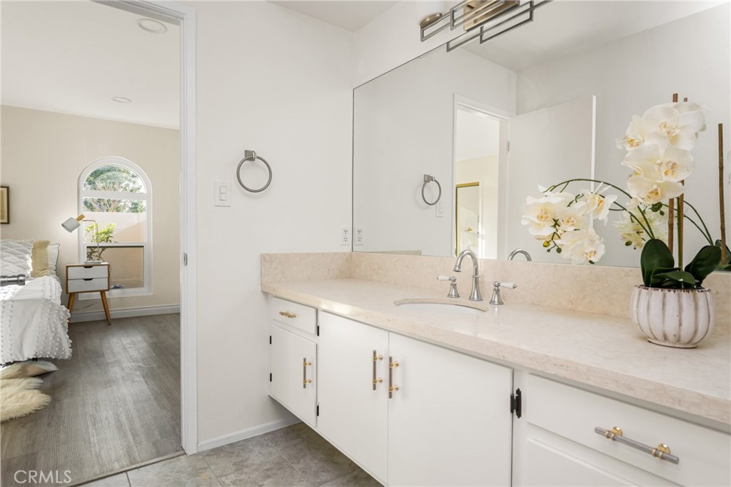 96 Seton Road Irvine, CA 92612 - Photo 41 of 51 a bathroom with a sink a mirror and a toilet