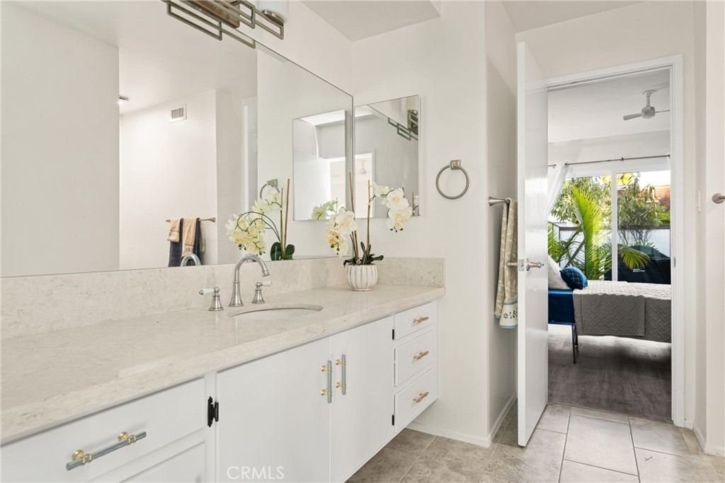 96 Seton Road Irvine, CA 92612 - Photo 43 of 51 a bathroom with a double vanity sink and a mirror