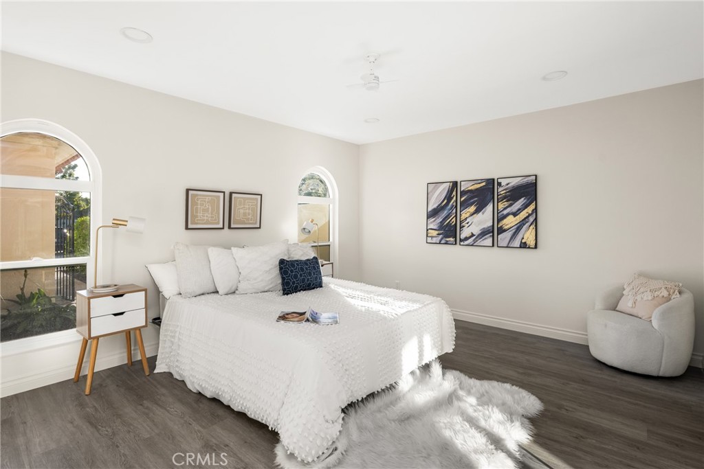 96 Seton Road Irvine, CA 92612 - Photo 46 of 51 a bedroom with a large bed and a view of living room