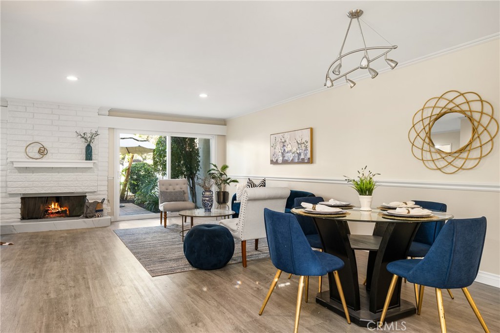 96 Seton Road Irvine, CA 92612 - Photo 9 of 51 a living room with furniture a fireplace a rug and a large window