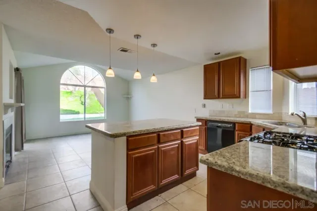 a kitchen that has a sink and a stove