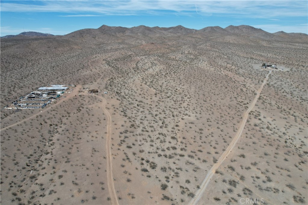 0 Oro Grande Oro Grande, CA 92368 - Photo 3 of 18 a view of a dry yard with mountains in the background