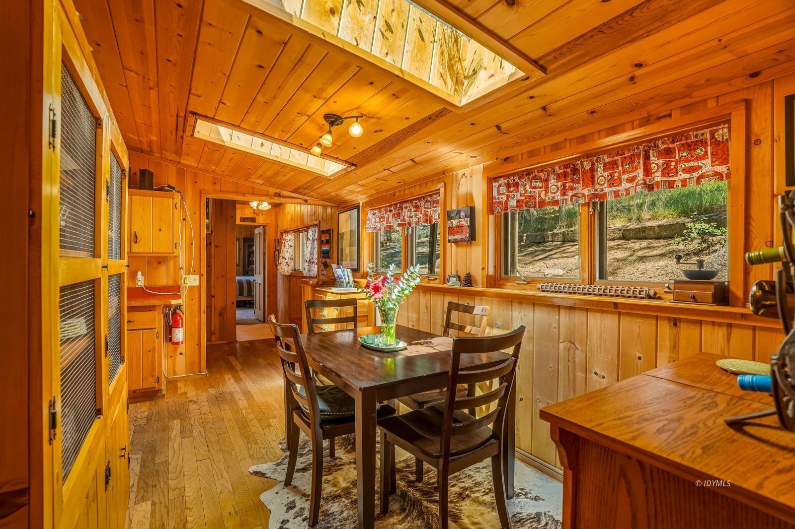 24945 Marion Ridge Drive Idyllwild, CA 92549 - Photo 20 of 53 a dining room with stainless steel appliances kitchen island granite countertop a table and chairs