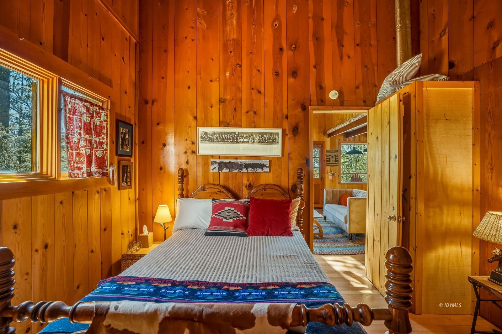 24945 Marion Ridge Drive Idyllwild, CA 92549 - Photo 23 of 53 a bedroom with a bed and wooden floor