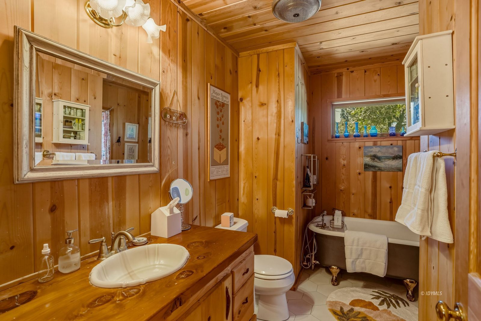 24945 Marion Ridge Drive Idyllwild, CA 92549 - Photo 31 of 53 a bathroom with a granite countertop toilet sink and mirror