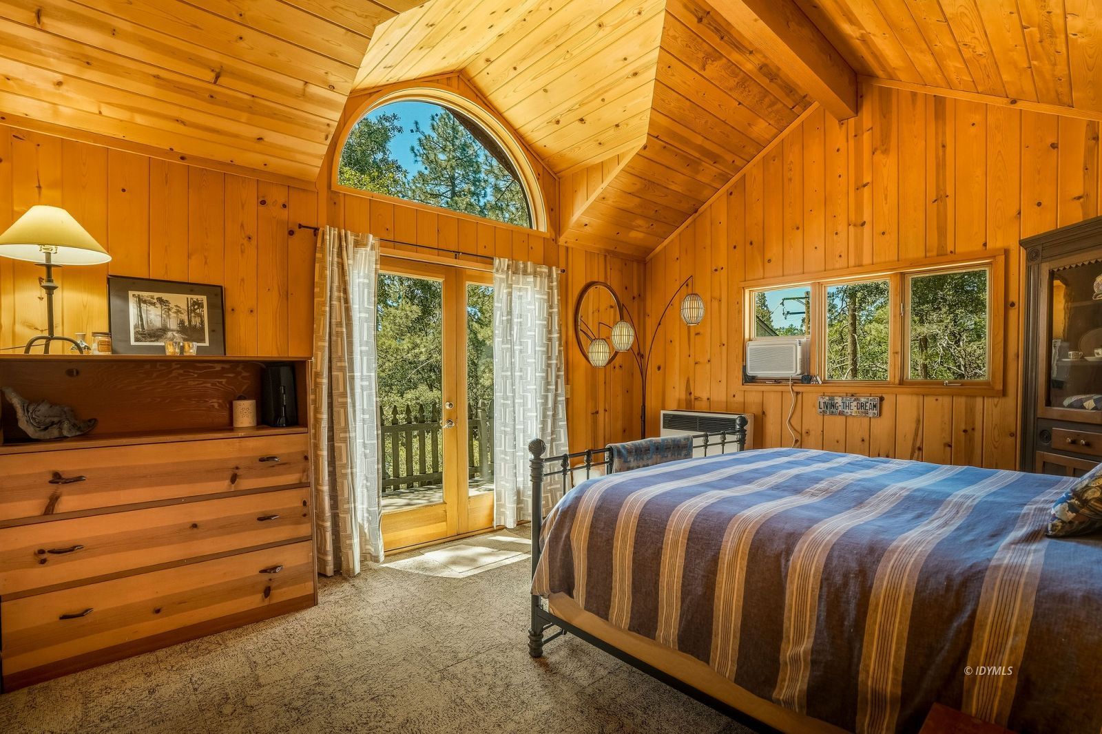24945 Marion Ridge Drive Idyllwild, CA 92549 - Photo 33 of 53 a bed sitting in a bedroom next to a window