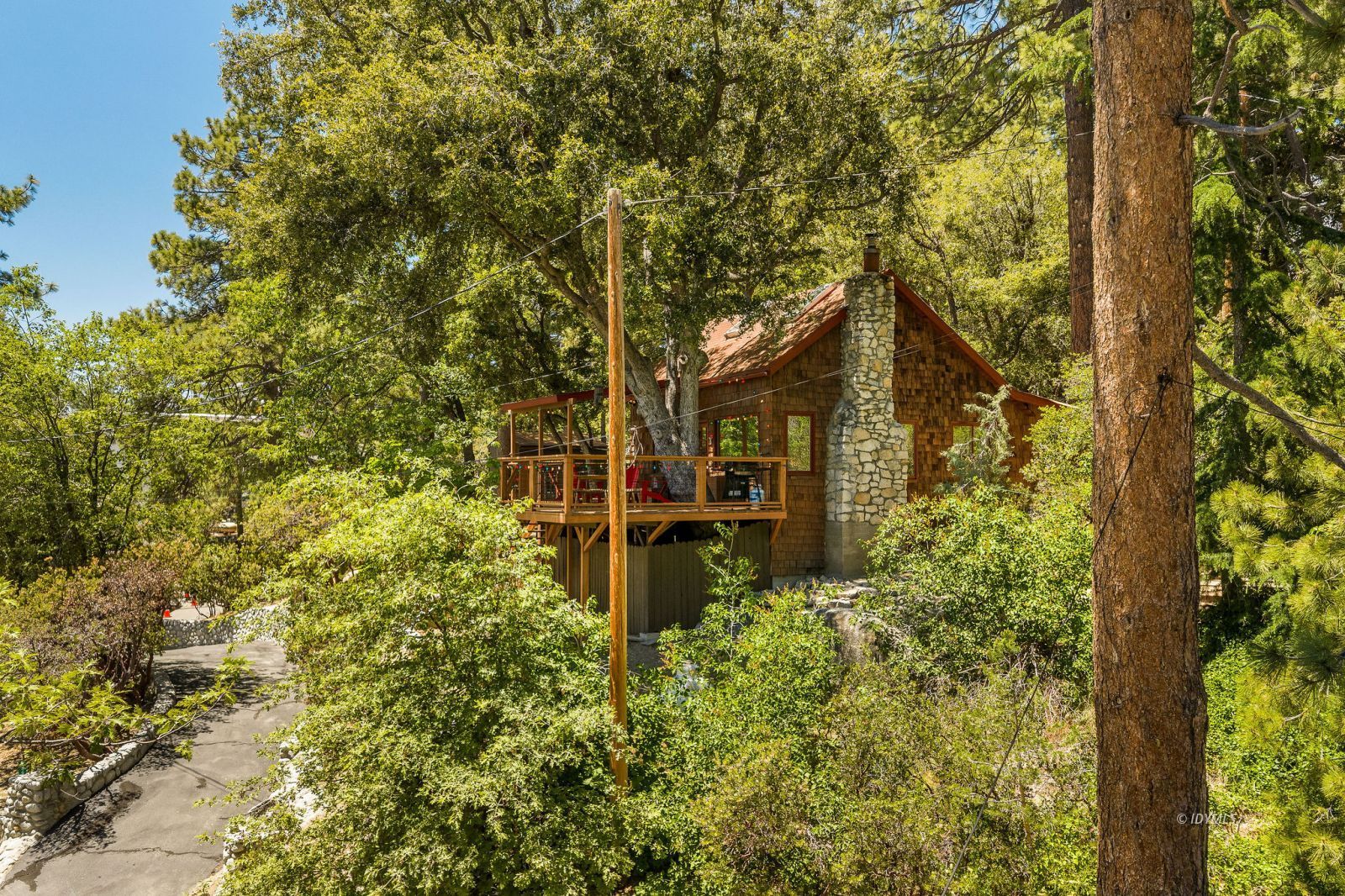 24945 Marion Ridge Drive Idyllwild, CA 92549 - Photo 46 of 53 a yellow building with trees in front of it