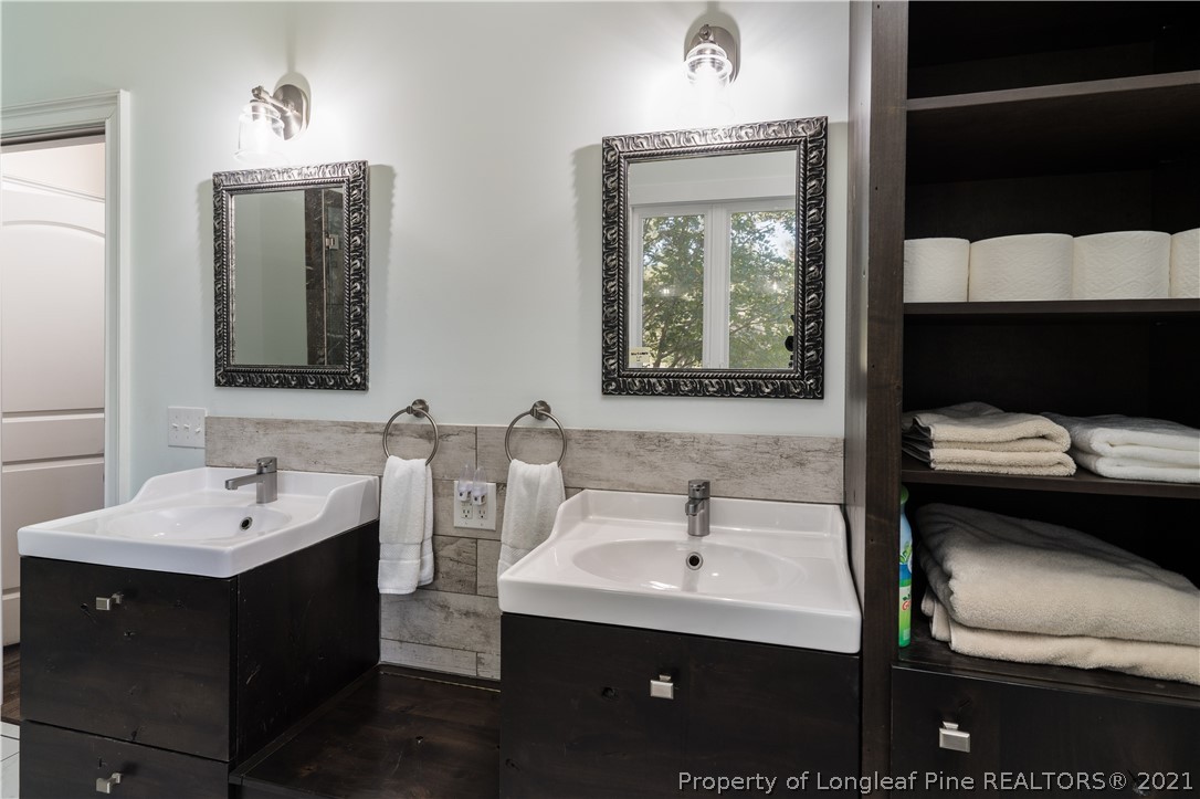 Undisclosed Address Aberdeen, NC 28315 - Photo 16 of 33 a en suite bathroom with a sink and a mirror