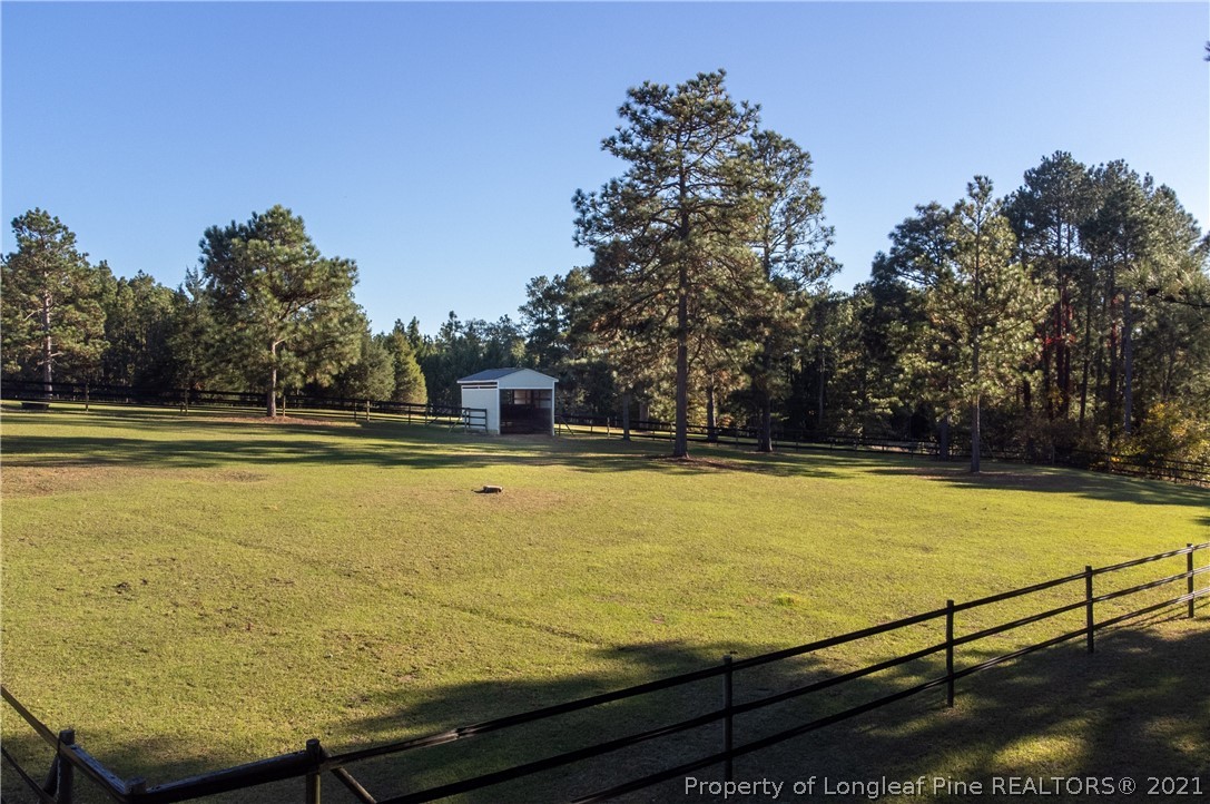 Undisclosed Address Aberdeen, NC 28315 - Photo 21 of 33 a view of a swimming pool with an outdoor seating