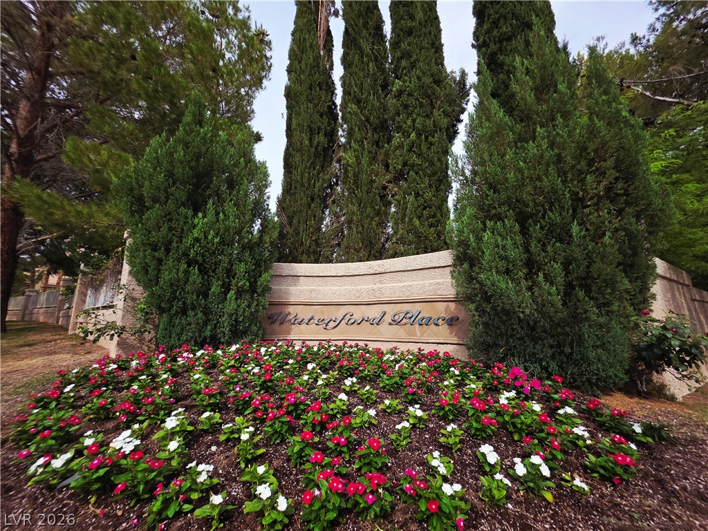 2920 Setting Sun Street Las Vegas, NV 89117 - Photo 4 of 43 Welcome to Waterford Place, where natural beauty and vibrant flowers create a captivating entrance.