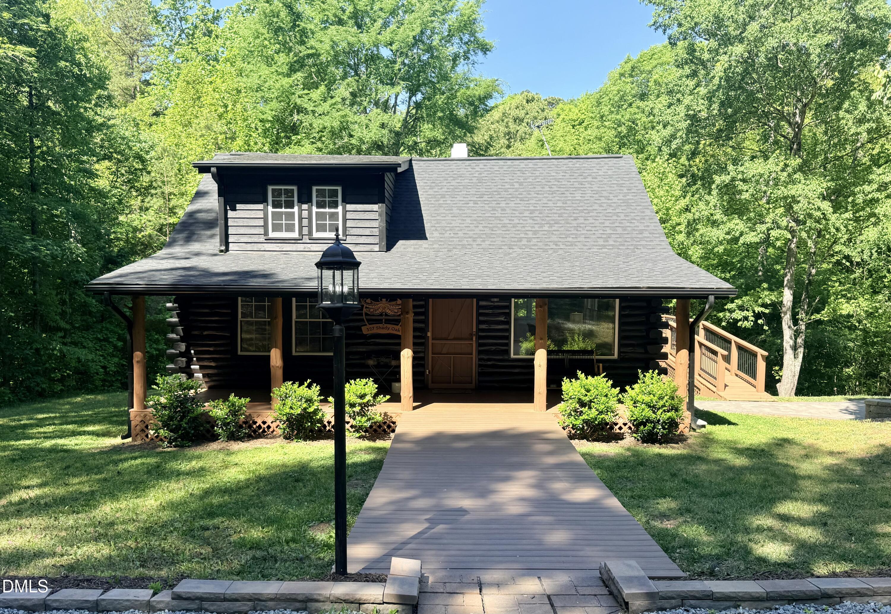 327 Shady Oak Road Roxboro, NC 27574 - Photo 61 of 62 a front view of a house with garden