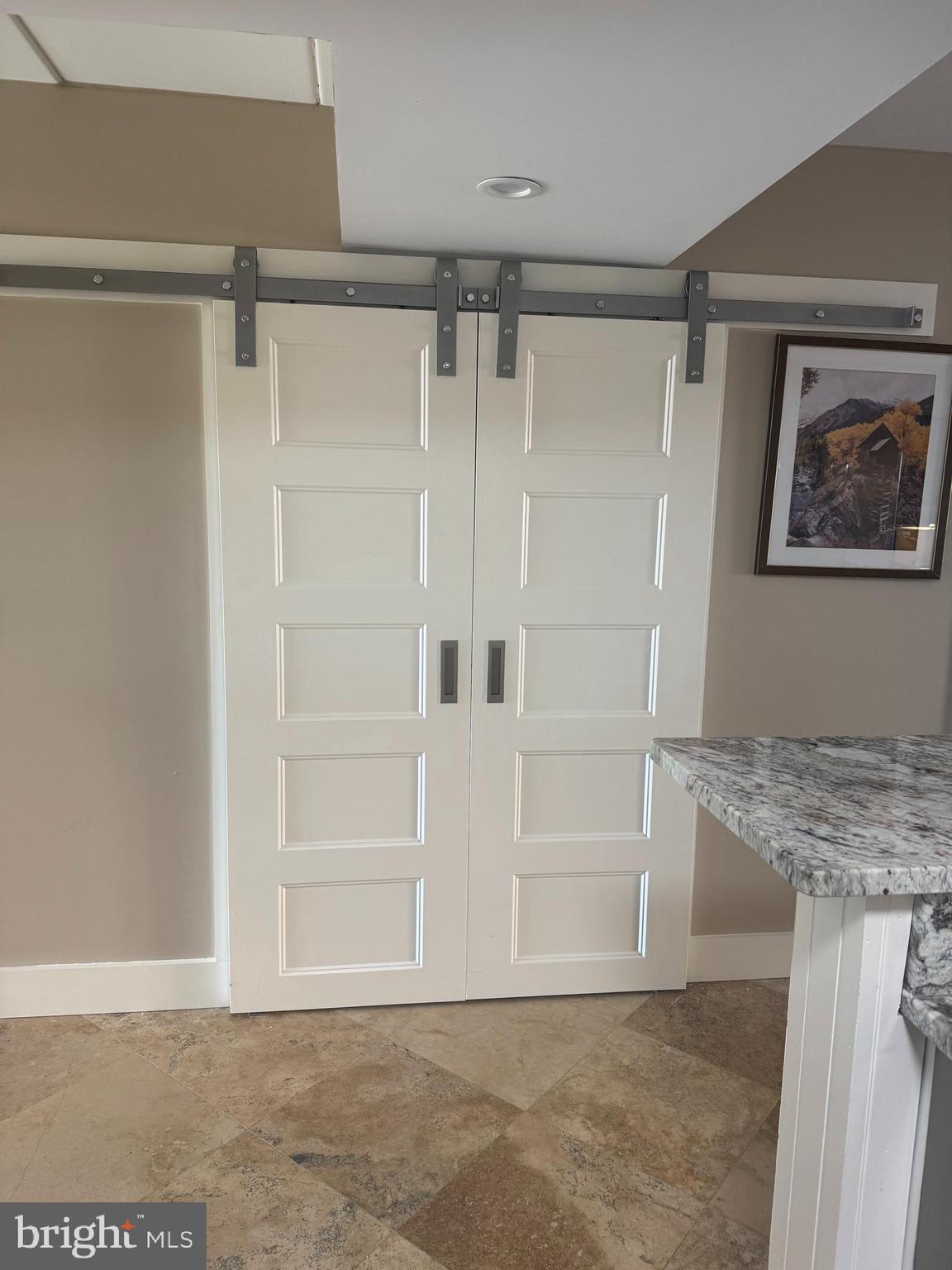 735 Bradley Road, Unit 206 Ocean City, MD 21842 - Photo 5 of 37 Barn doors on pantry
