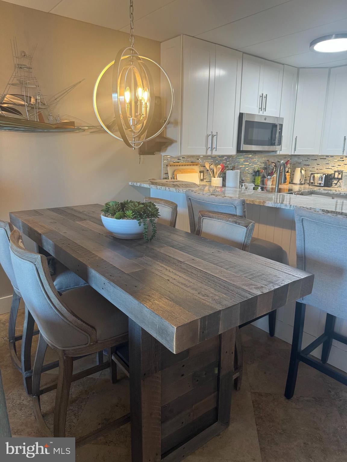 735 Bradley Road, Unit 206 Ocean City, MD 21842 - Photo 7 of 37 Bar stools and dining area