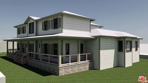 a view of large white house with a large windows