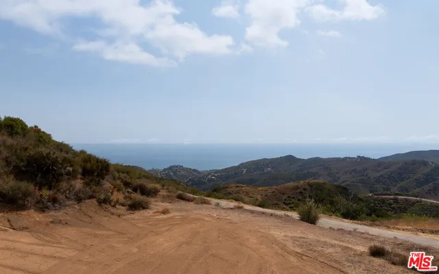 a view of a lake with mountains in the background
