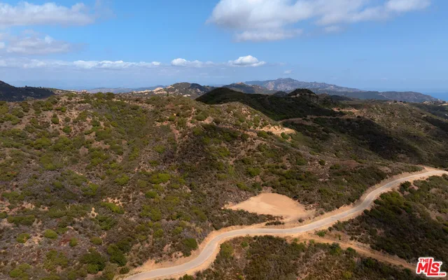 a view of a lake with mountains in the background