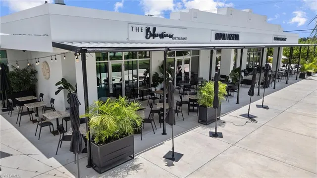 a view of a chairs and table in a patio