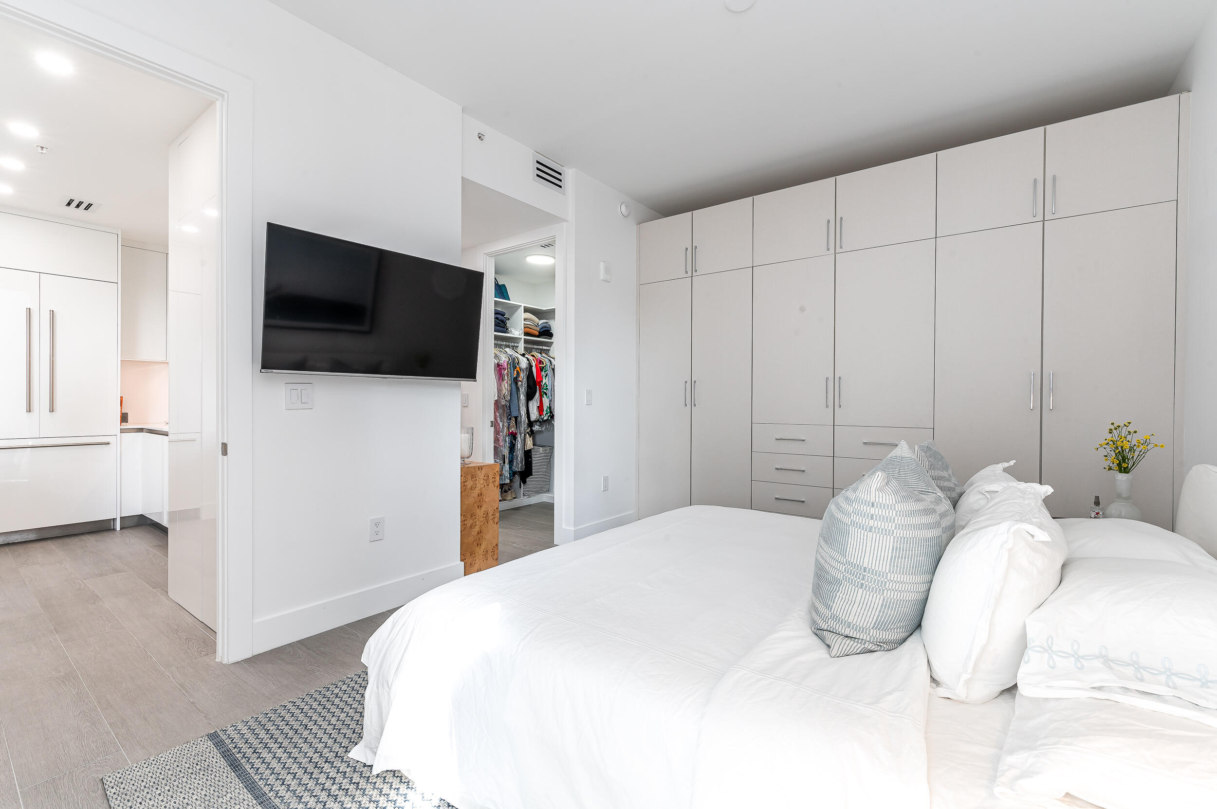 155 East Boca Raton Road, Unit 1008 Boca Raton, FL 33432 - Photo 11 of 42 a bedroom with a bed and a flat screen tv