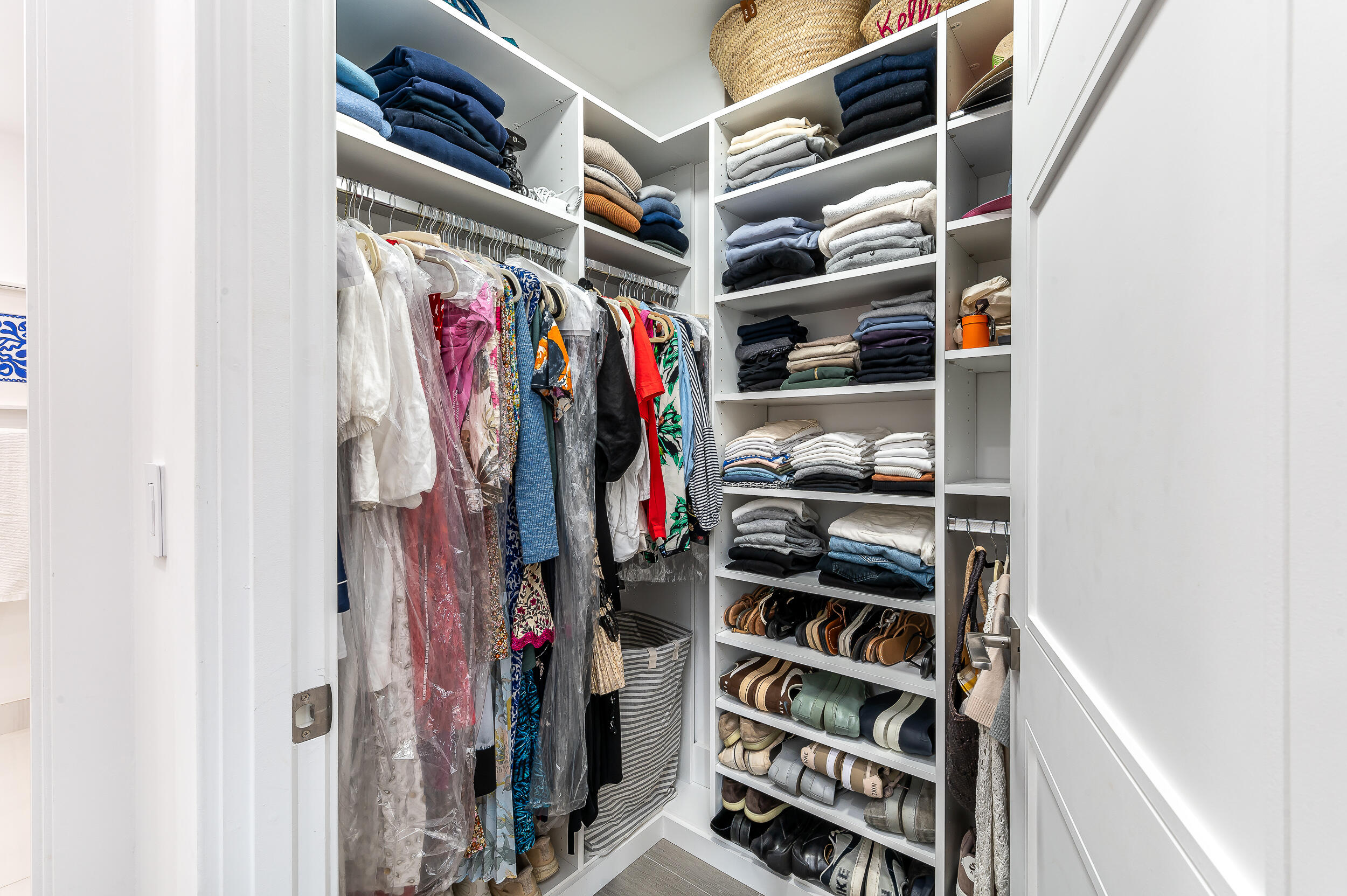 155 East Boca Raton Road, Unit 1008 Boca Raton, FL 33432 - Photo 12 of 42 a view of walk in closet with clothes and shoes