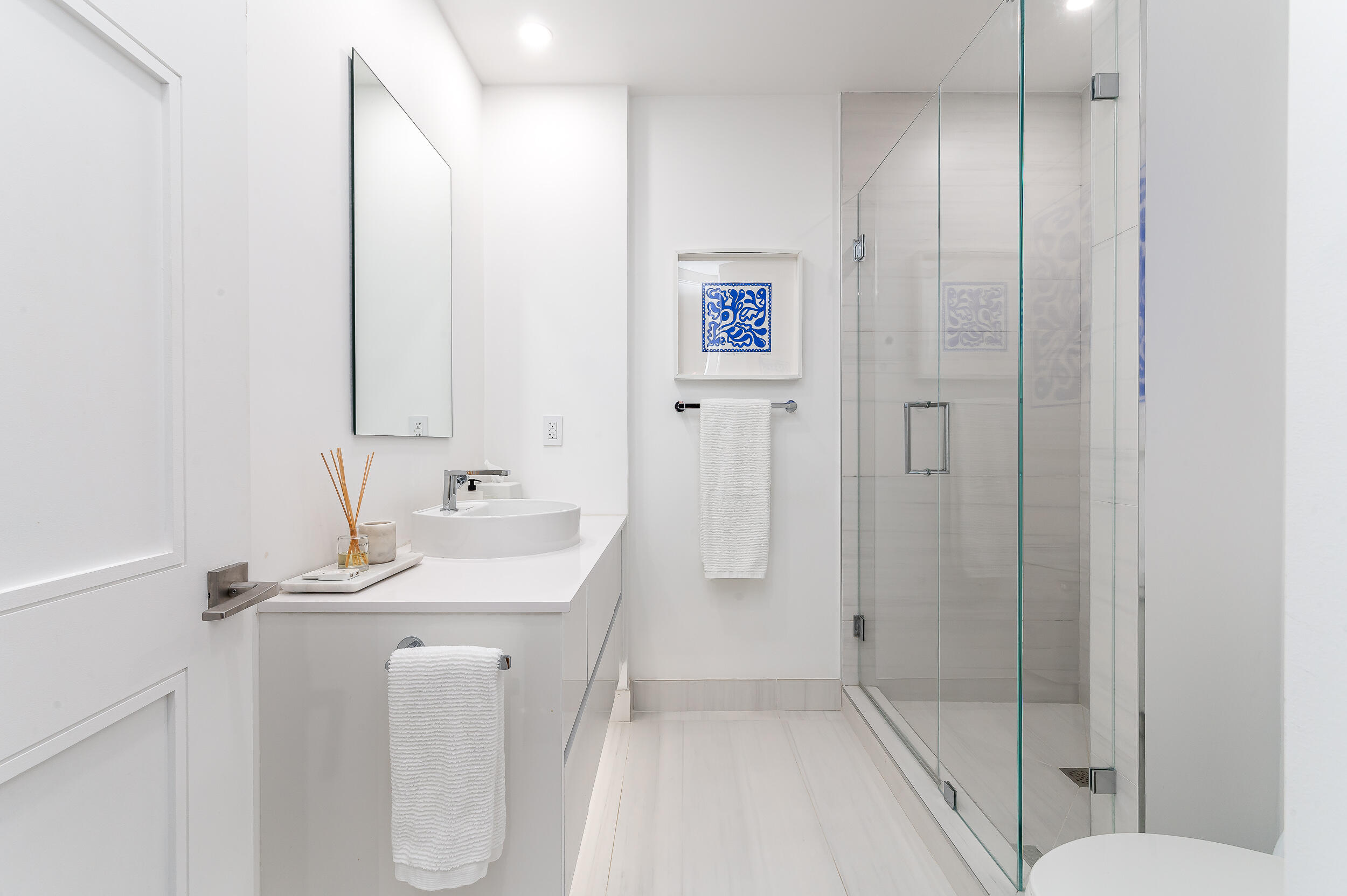 155 East Boca Raton Road, Unit 1008 Boca Raton, FL 33432 - Photo 13 of 42 a bathroom with a sink a toilet and shower